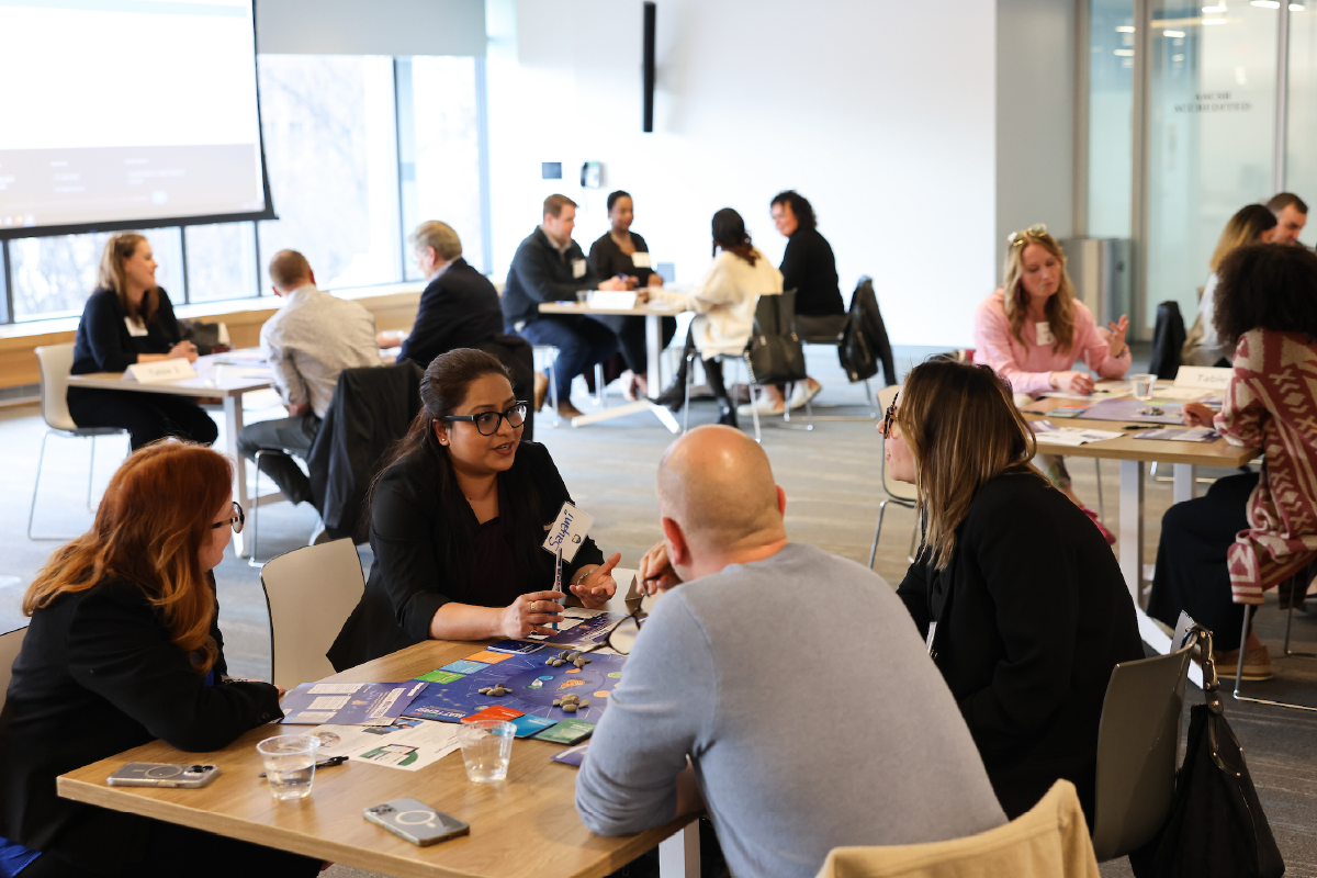 Professionals meet in small groups at a workshop facilitated by Erica Mattison