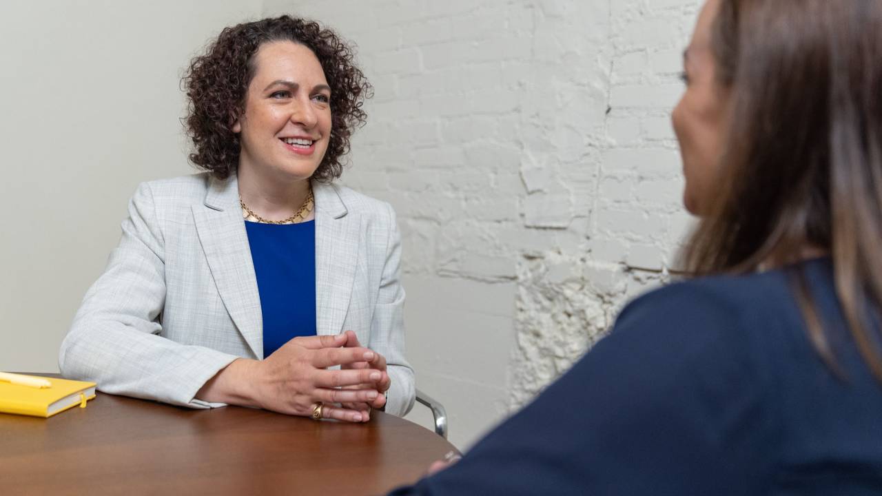 Erica meets with a client