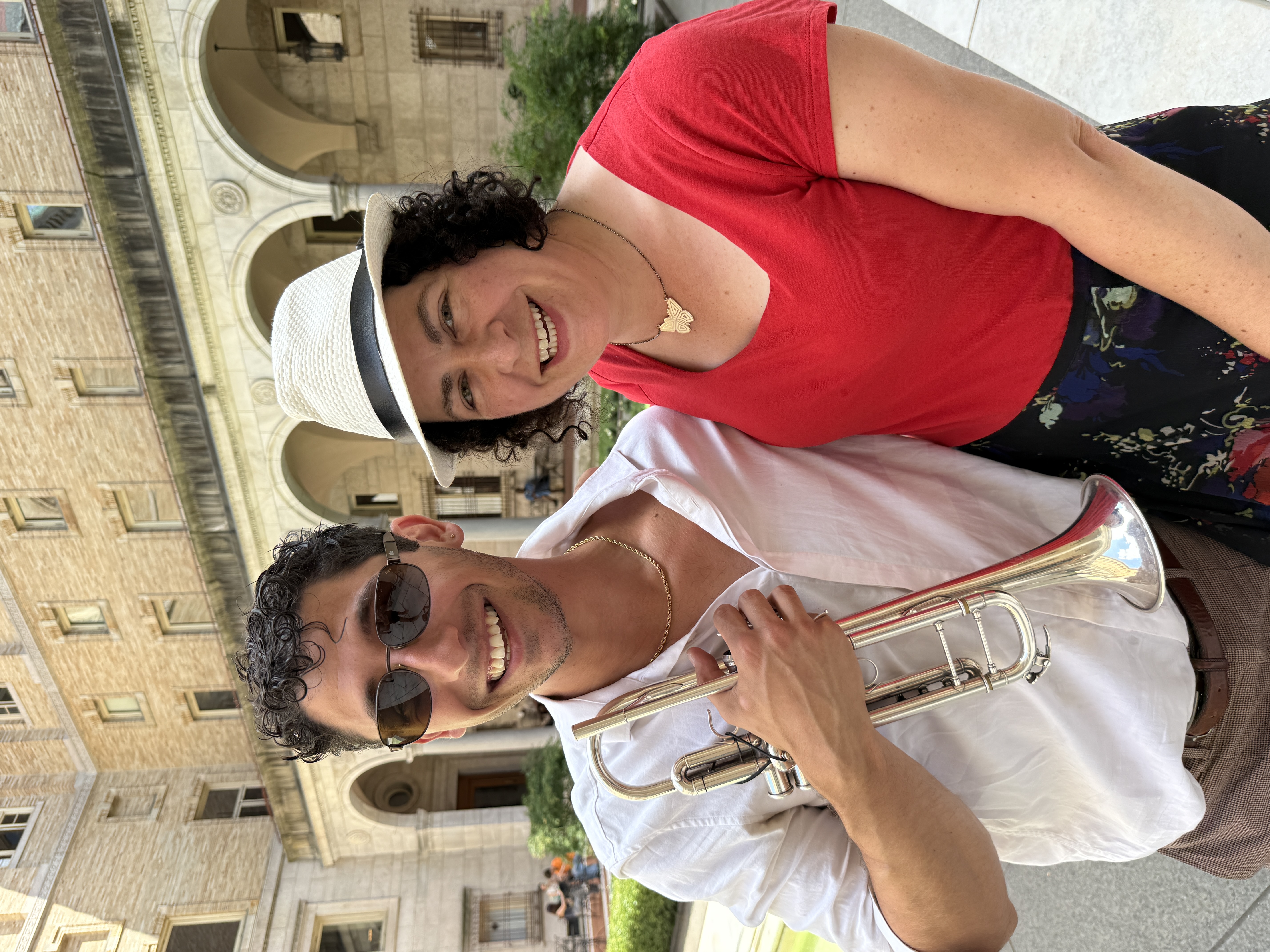John Glennon with trumpet and Erica Mattison in Boston Public Library Main Branch Courtyard