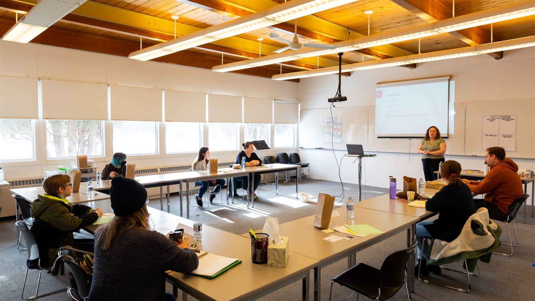 Sport board members seated around a meeting table during a governance discussion