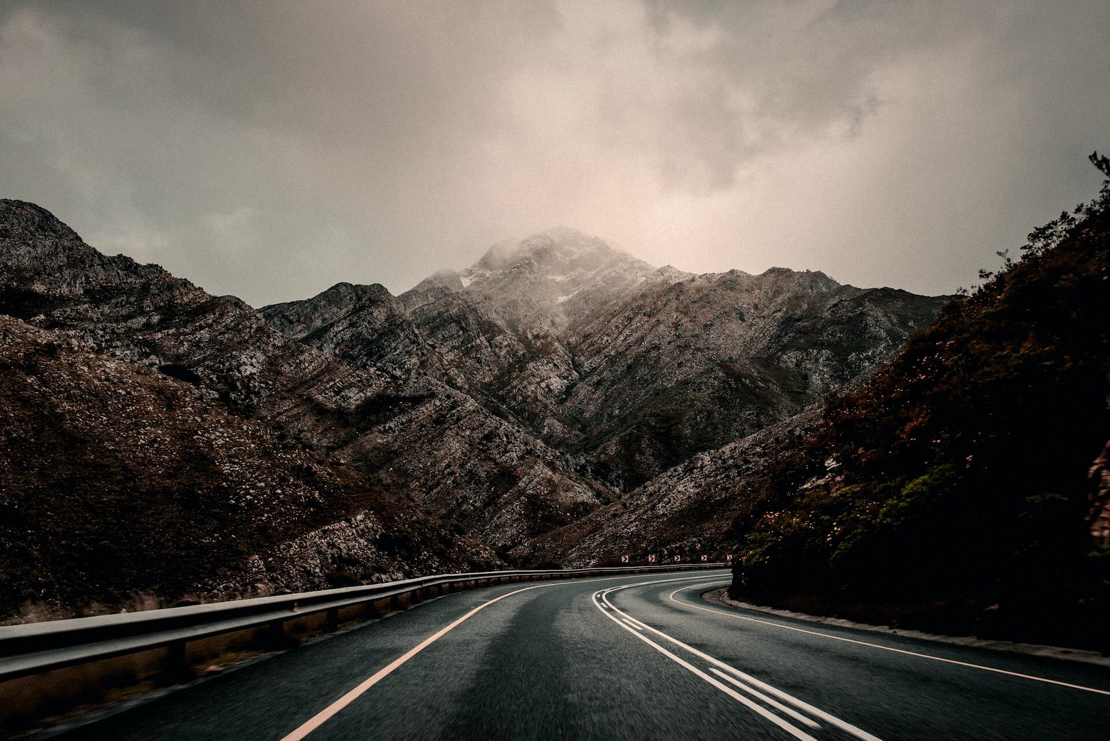 A road winding through mountain ranges