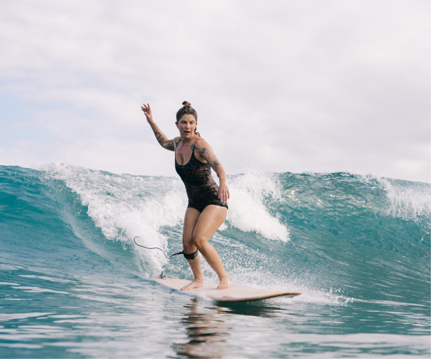 Surfers holding hand and riding a small wave comfortably, surf retreat guest is so happy, cheering and smiling