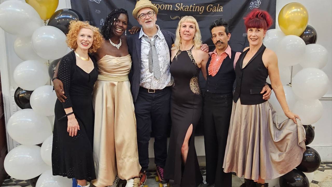 6 roller skaters in a group photo at the elelegence ballroomroom gala 2026