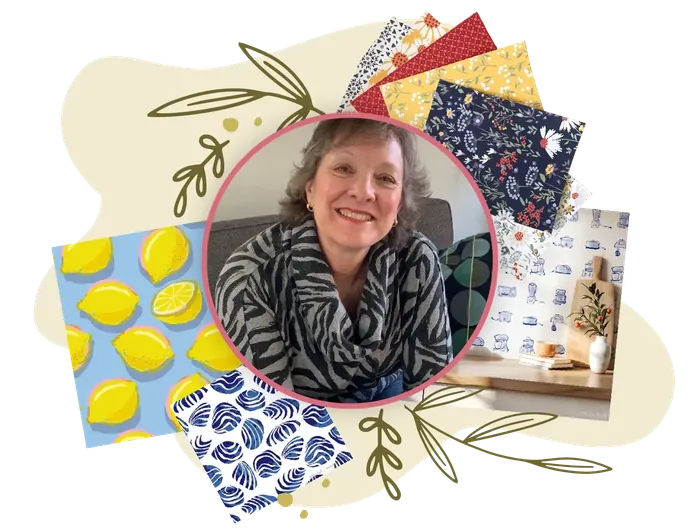 Kris Ruff surrounded by examples of her artwork and products