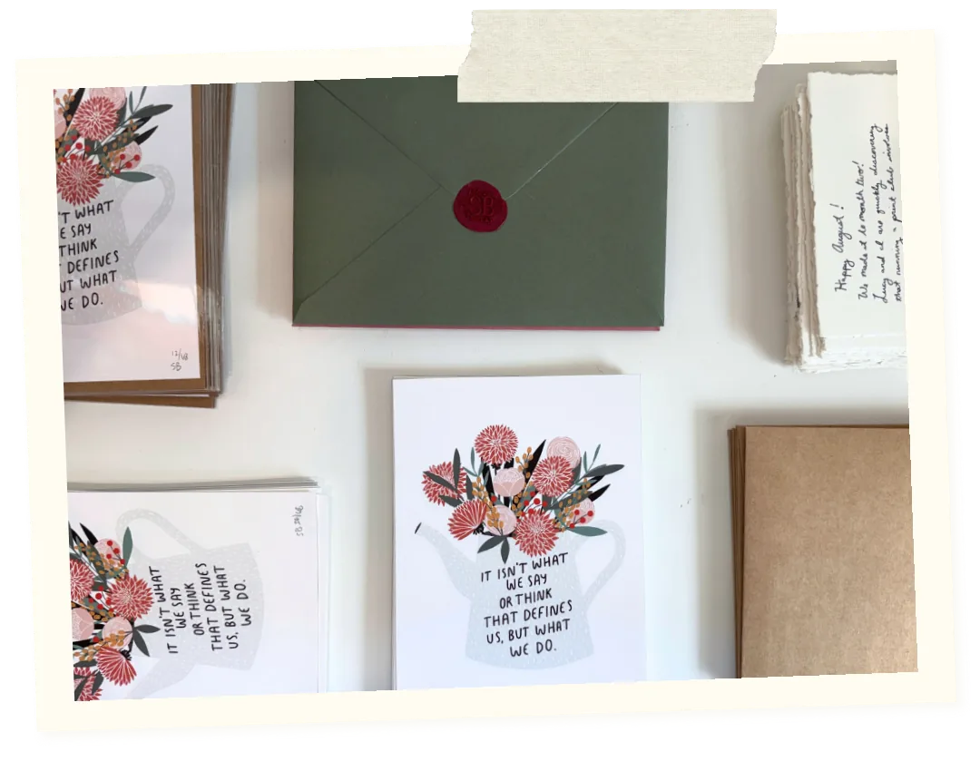 Print club flat lay: prints, packaging, and shipping supplies on one table