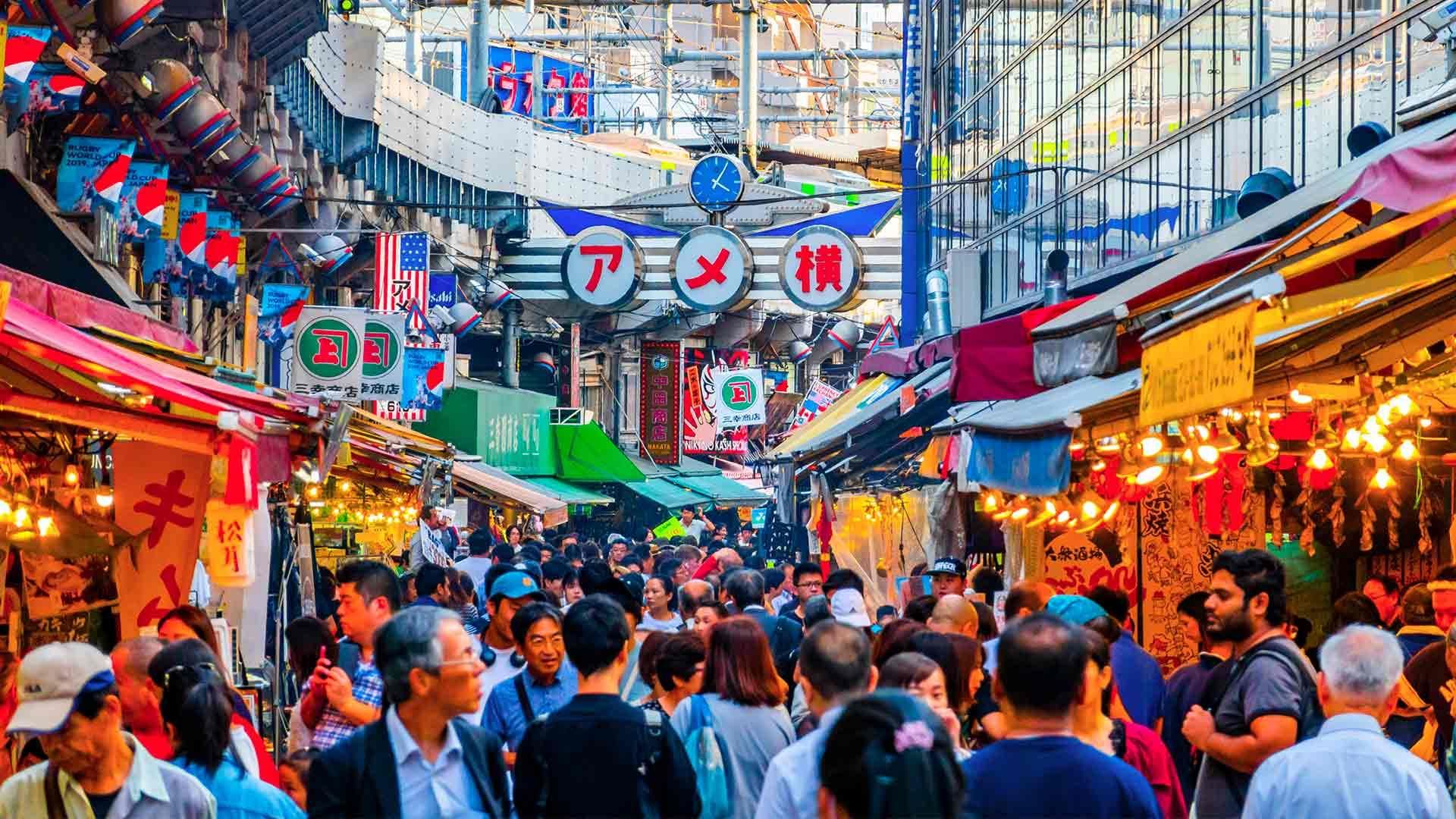 Solo woman walking through the vibrant streets of Tokyo, rediscovering joy, confidence and a sense of being alive after grief.