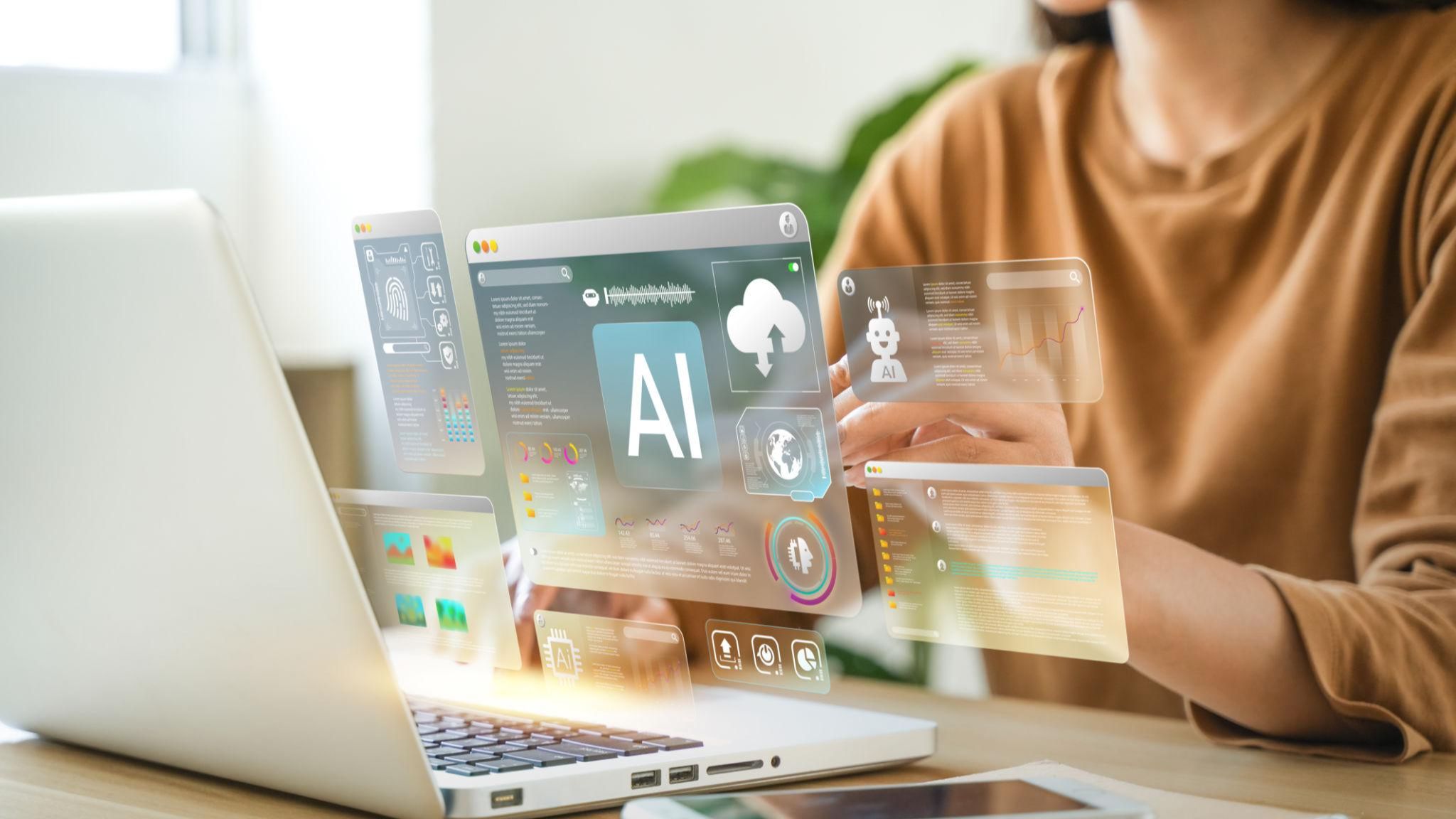 Experienced businesswoman using AI tools on a laptop in a modern workspace