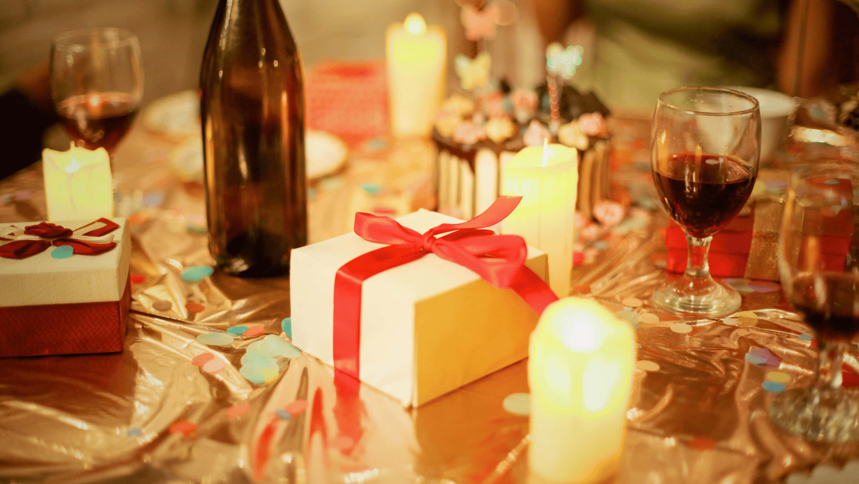 A festive table with a mix of drinks in candlelight — managing alcohol at Christmas is about planning, not deprivation