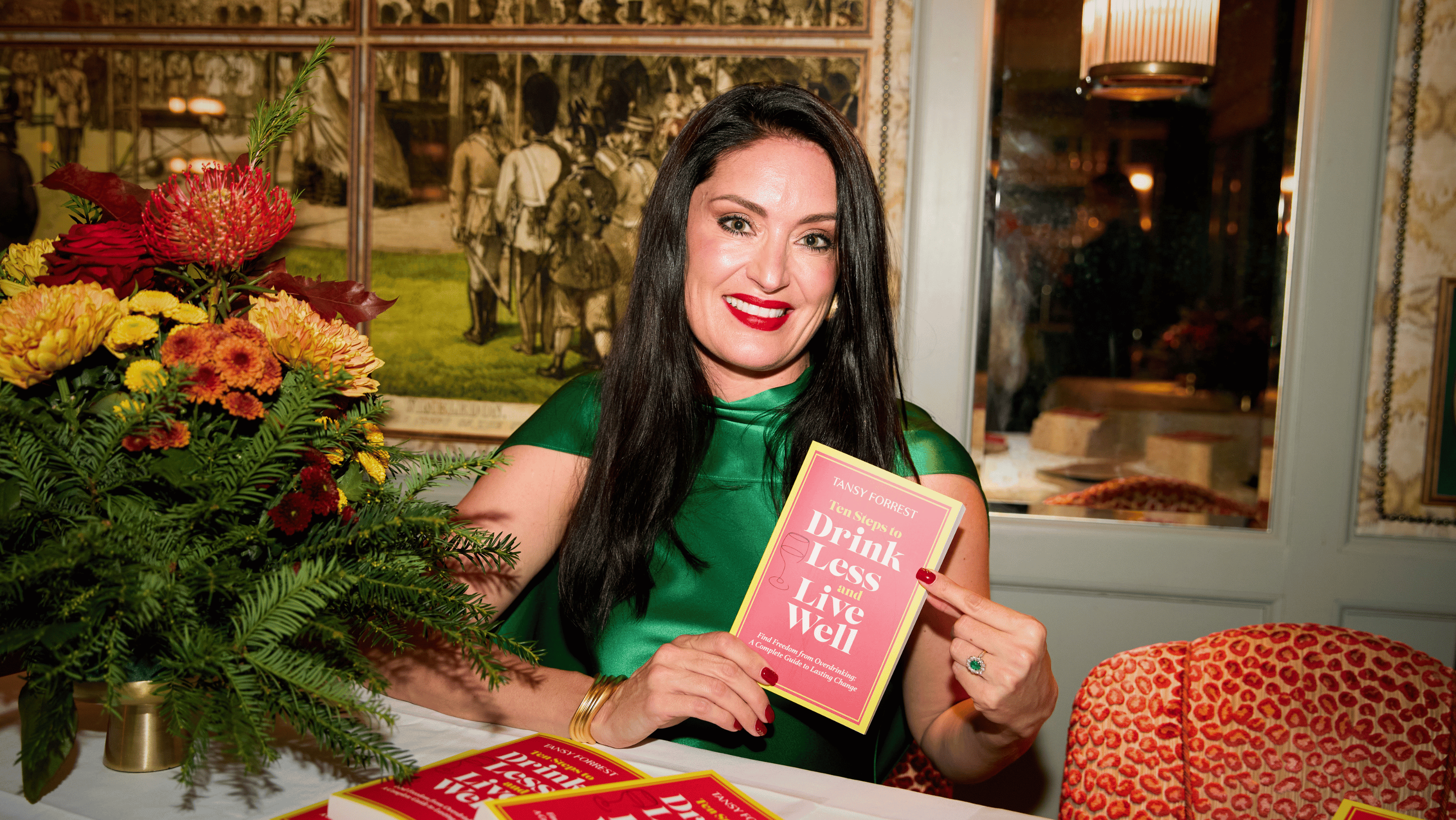 Picture of Tansy Forrest holding the book Ten Steps to Drink Less and Live Well