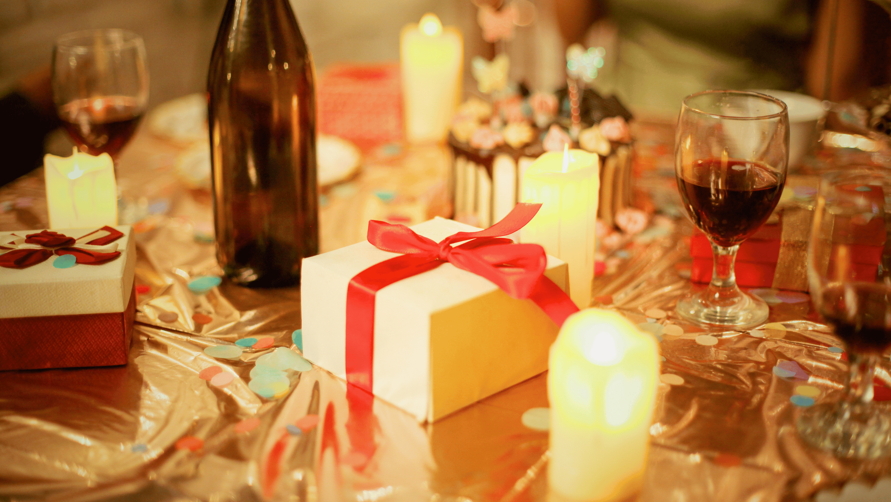 A festive table with a mix of drinks in candlelight — managing alcohol at Christmas is about planning, not deprivation