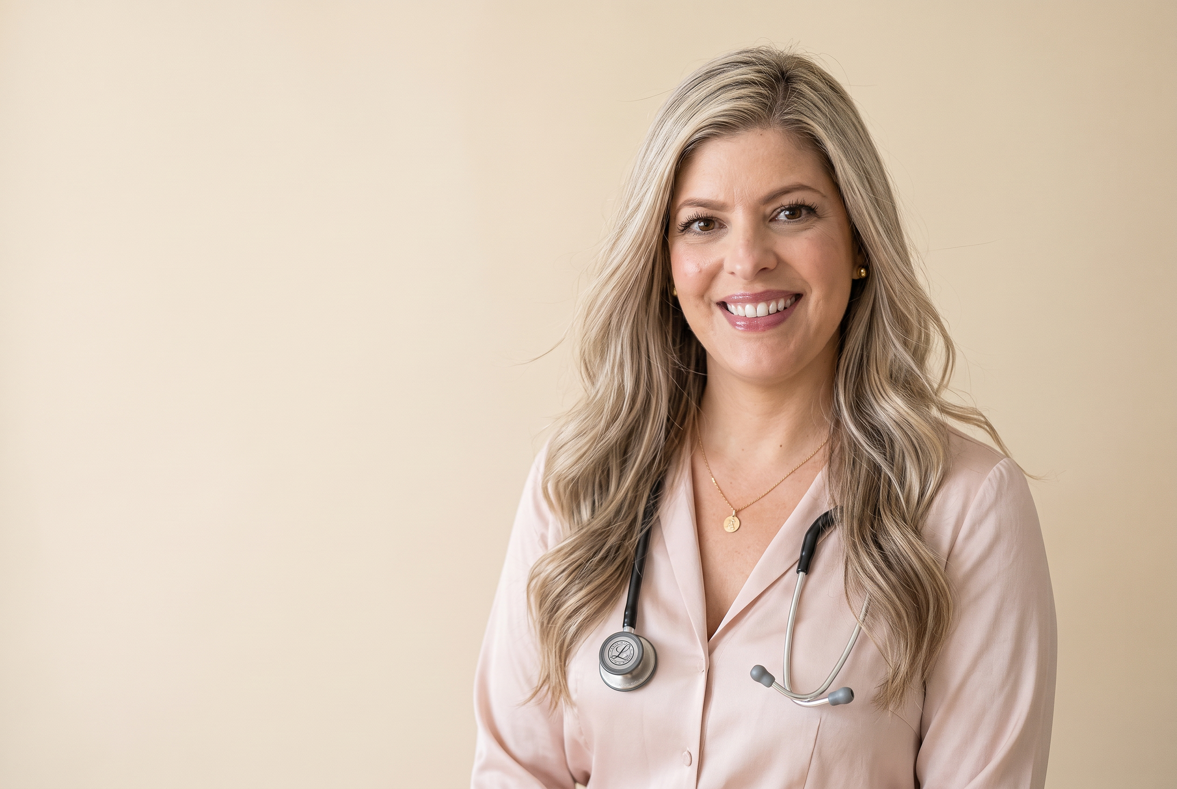 Lindsay Goodwin, founder of Fertile Frequencies, wearing her stethoscope