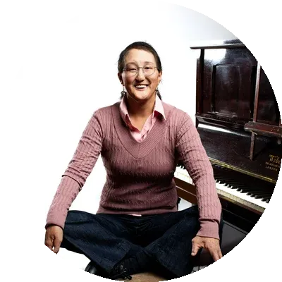 Maestro piano, voice, and drums instructor, Camille