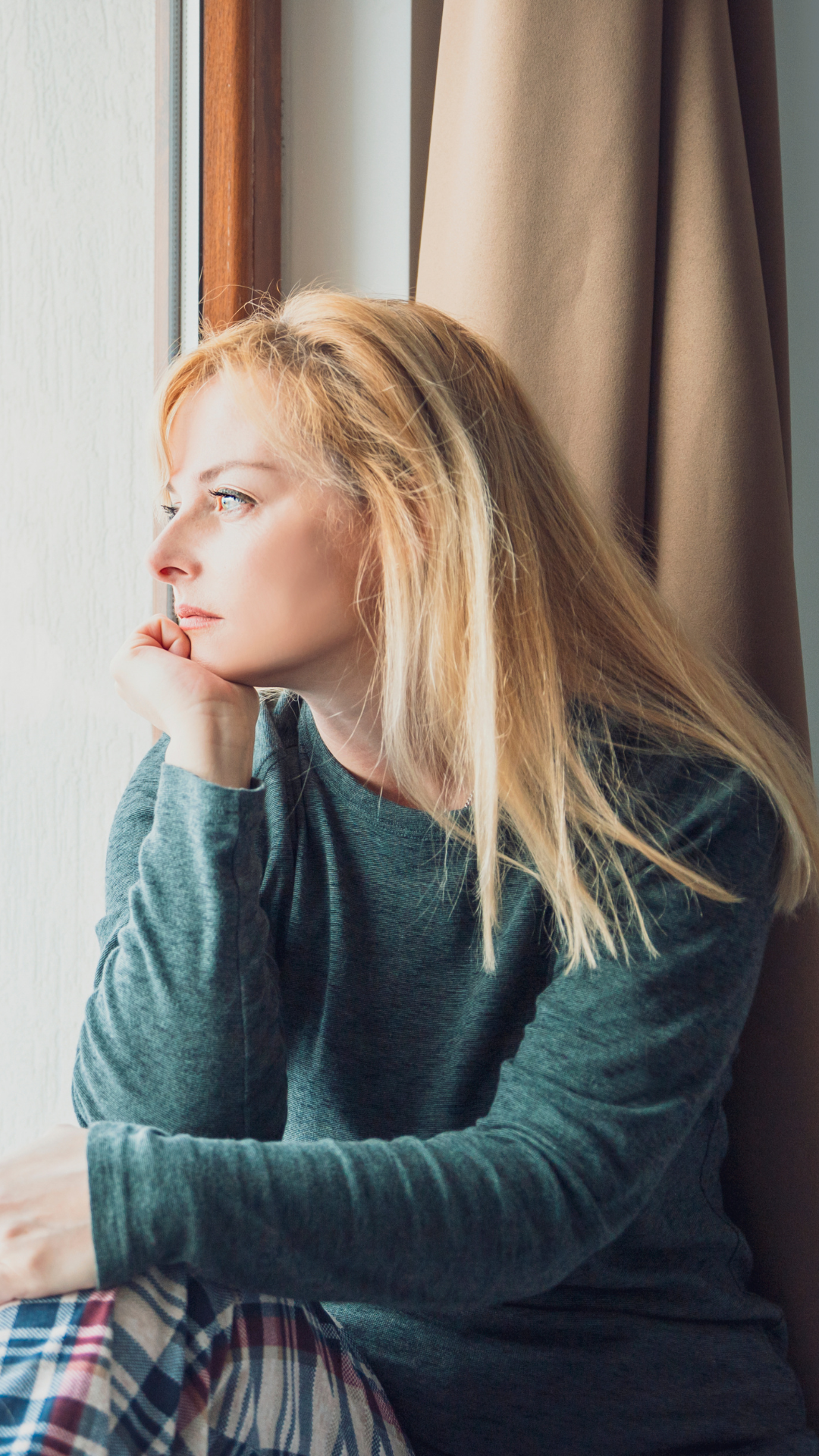 A woman looking out a window