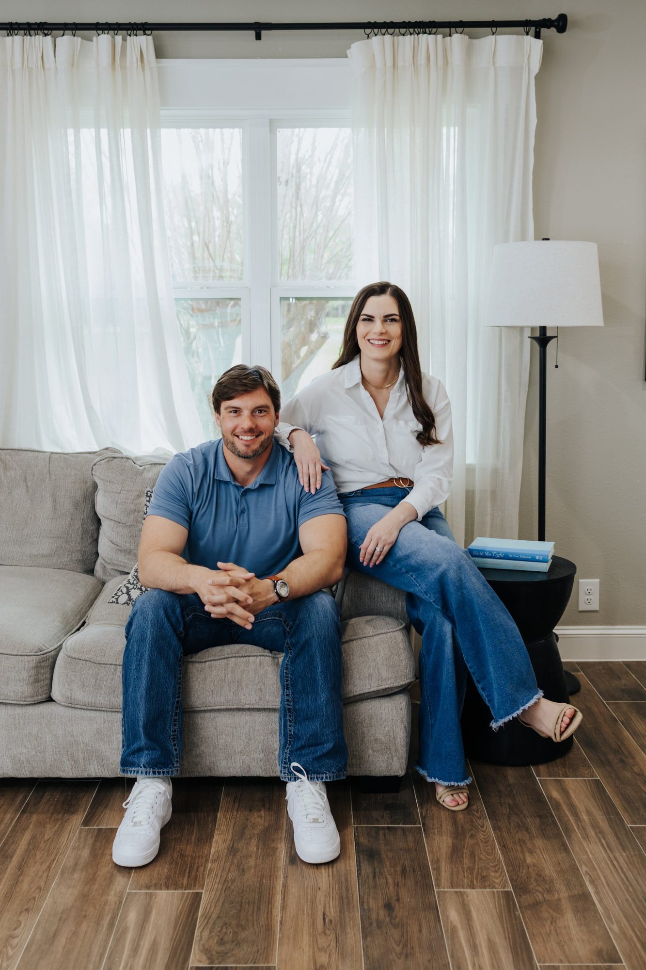 Chase and Katie sitting together on their couch