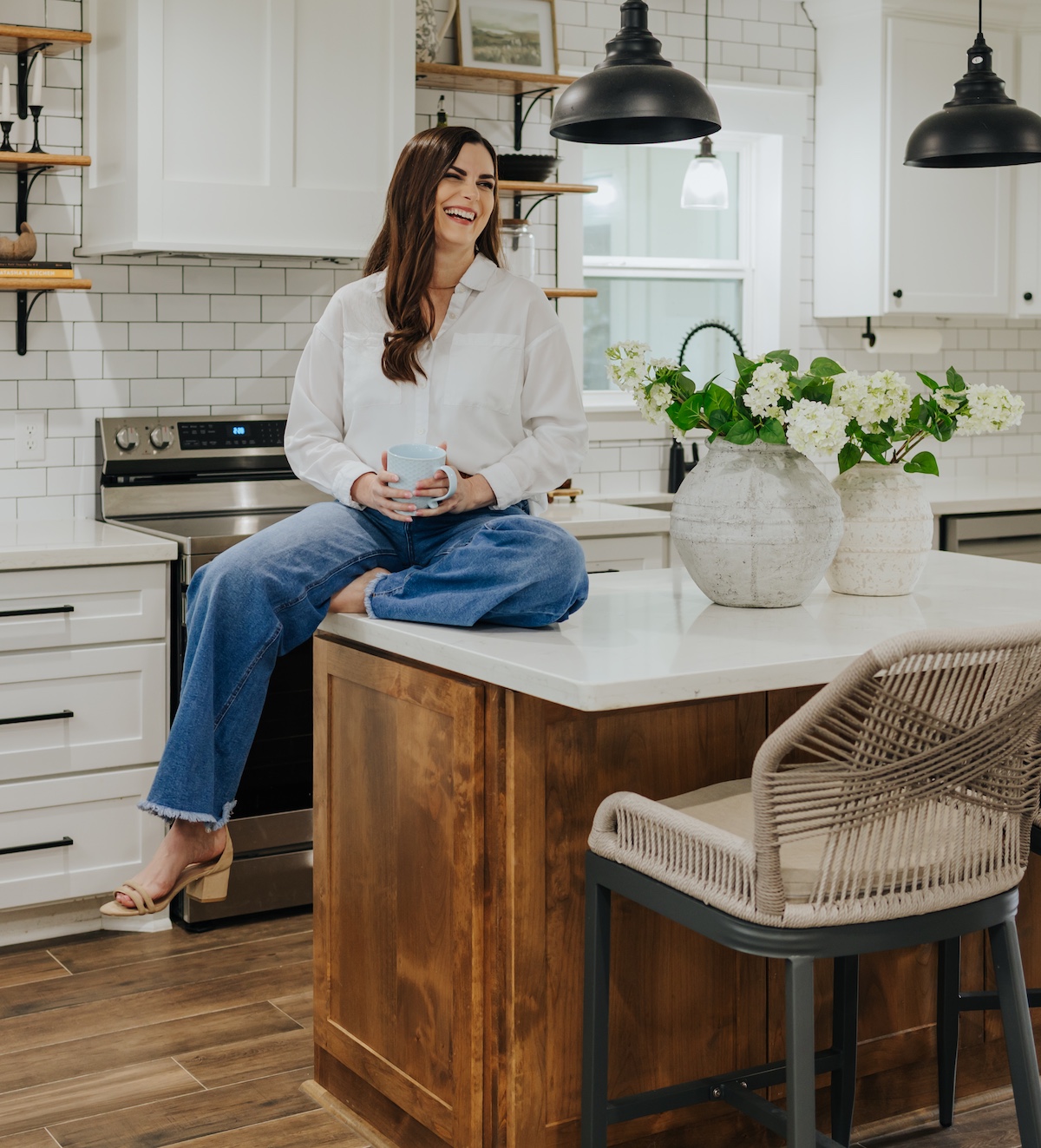 Kathryn seated on her kitchen island