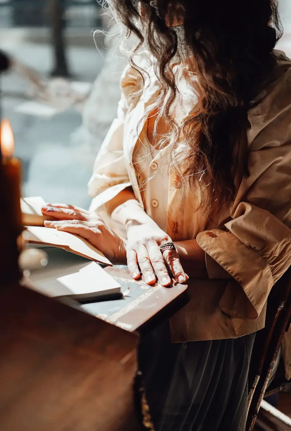 Woman engages with her daily reflections, noting down what is revealed to her each day