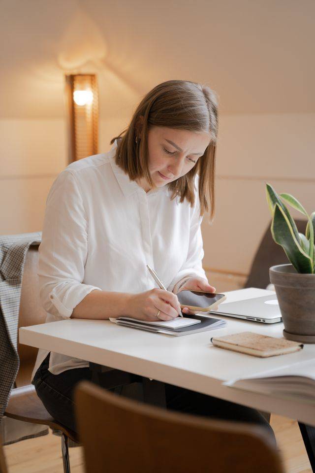 Woman engages with her daily reflections, noting down what is revealed to her each day