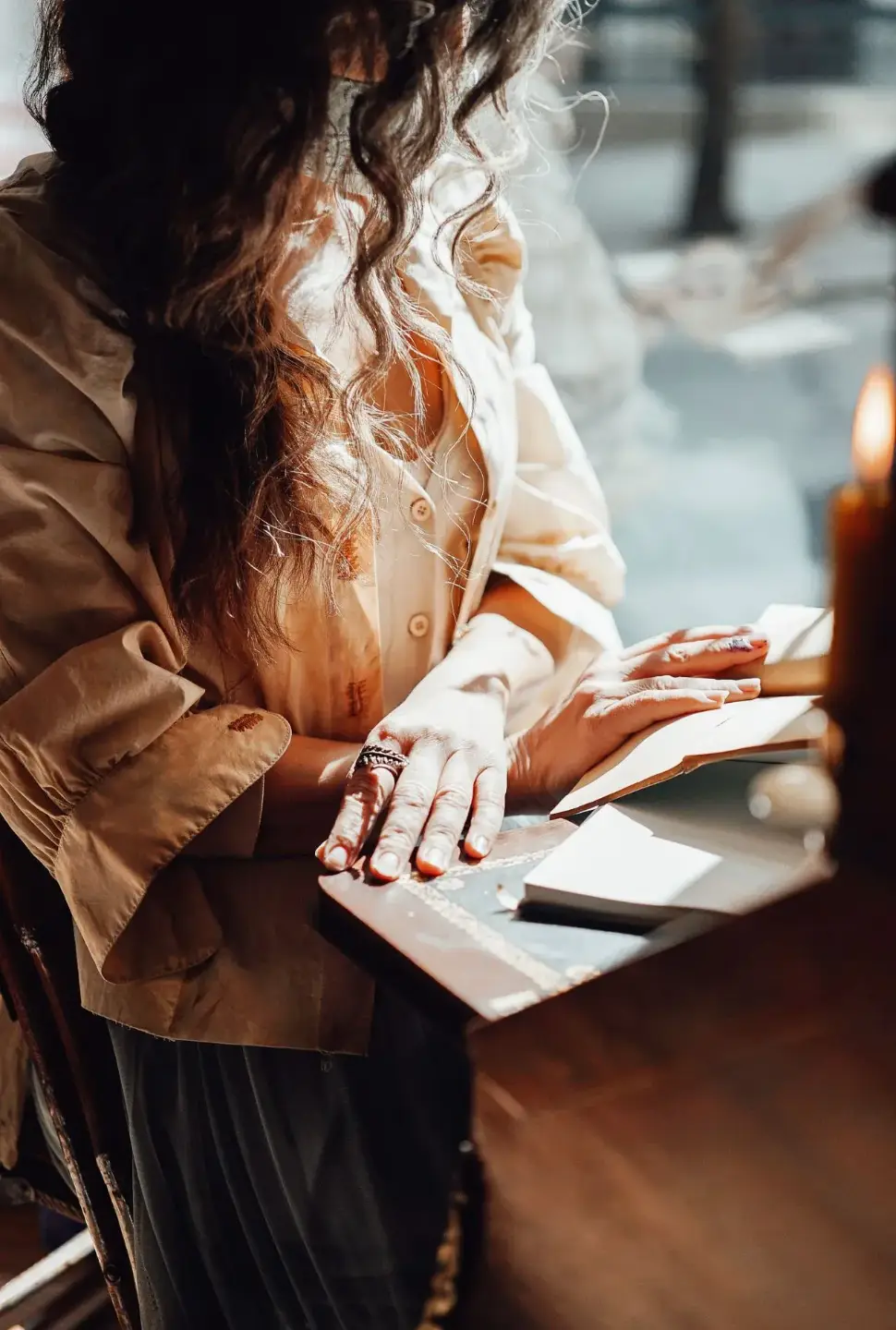 Woman engages with her daily reflections, noting down what is revealed to her each day