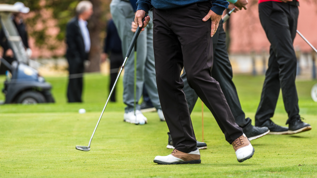 Busy golf course with golfers going through a charity golf tournament scramble