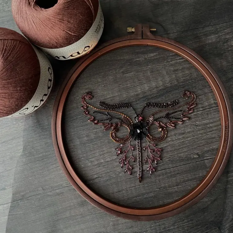 Beaded butterfly on an embroidery hoop, student work, tambour Haute Couture technique