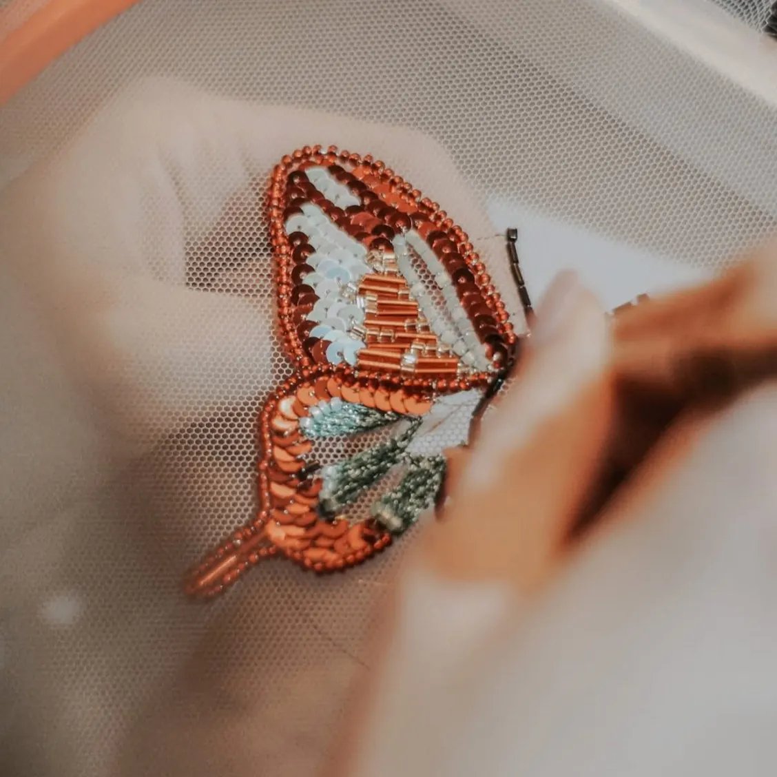 Haute couture butterfly embroidery in progress