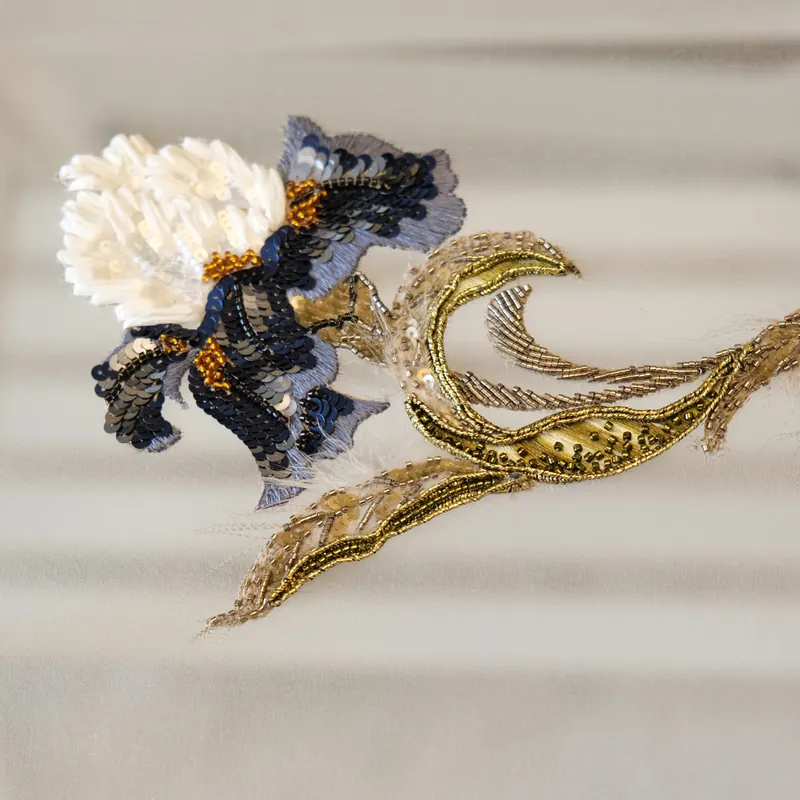 Finished navy and gold sequinned iris appliqué on silk, Advanced Level II Lunéville embroidery, School of Couture