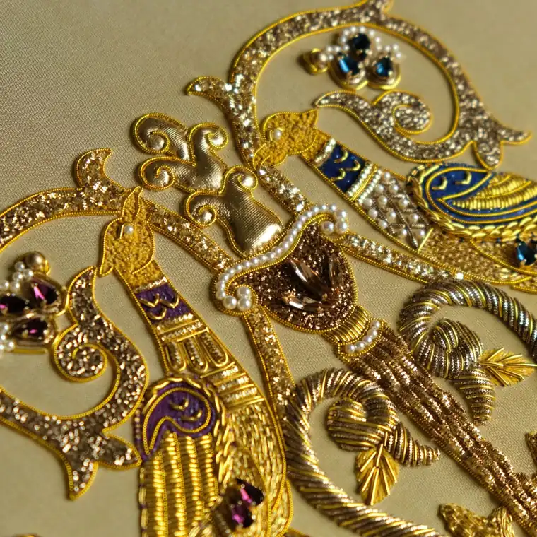 Angled view of the goldwork main project on gold silk taffeta