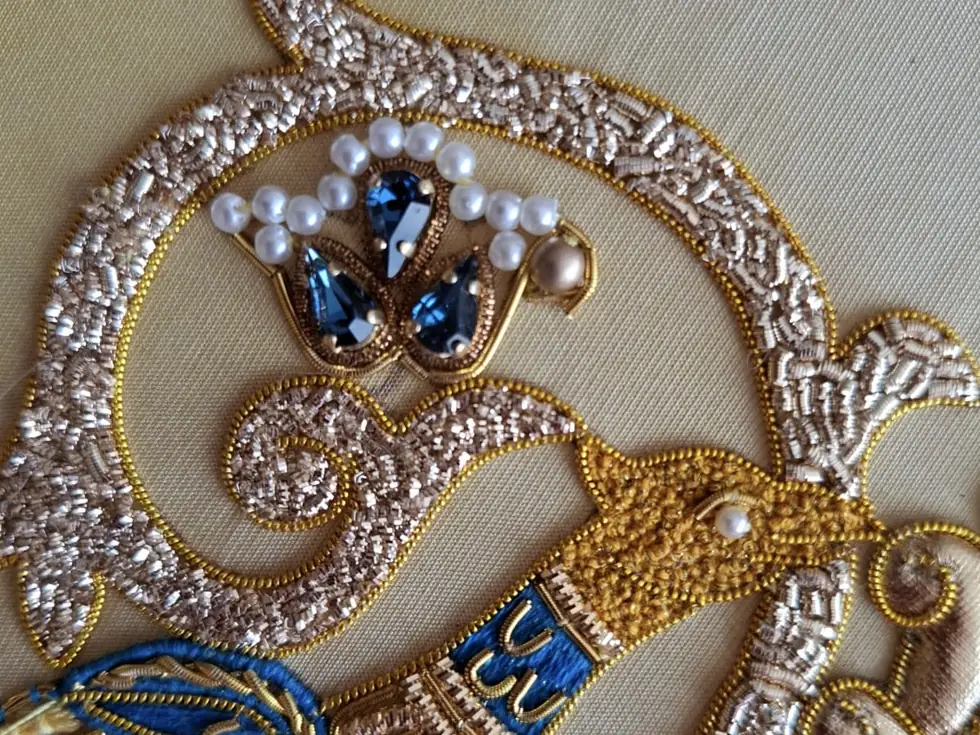 Close-up of goldwork embroidery with pearls, jewels and metal-thread purl work