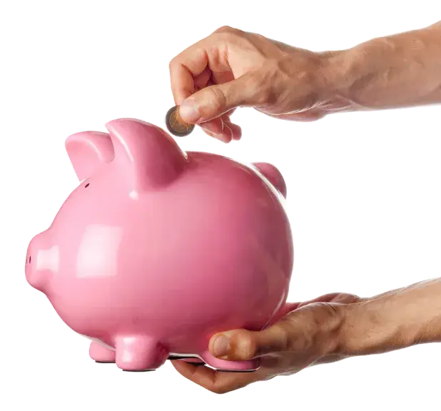 Hand adding coin to a piggybank