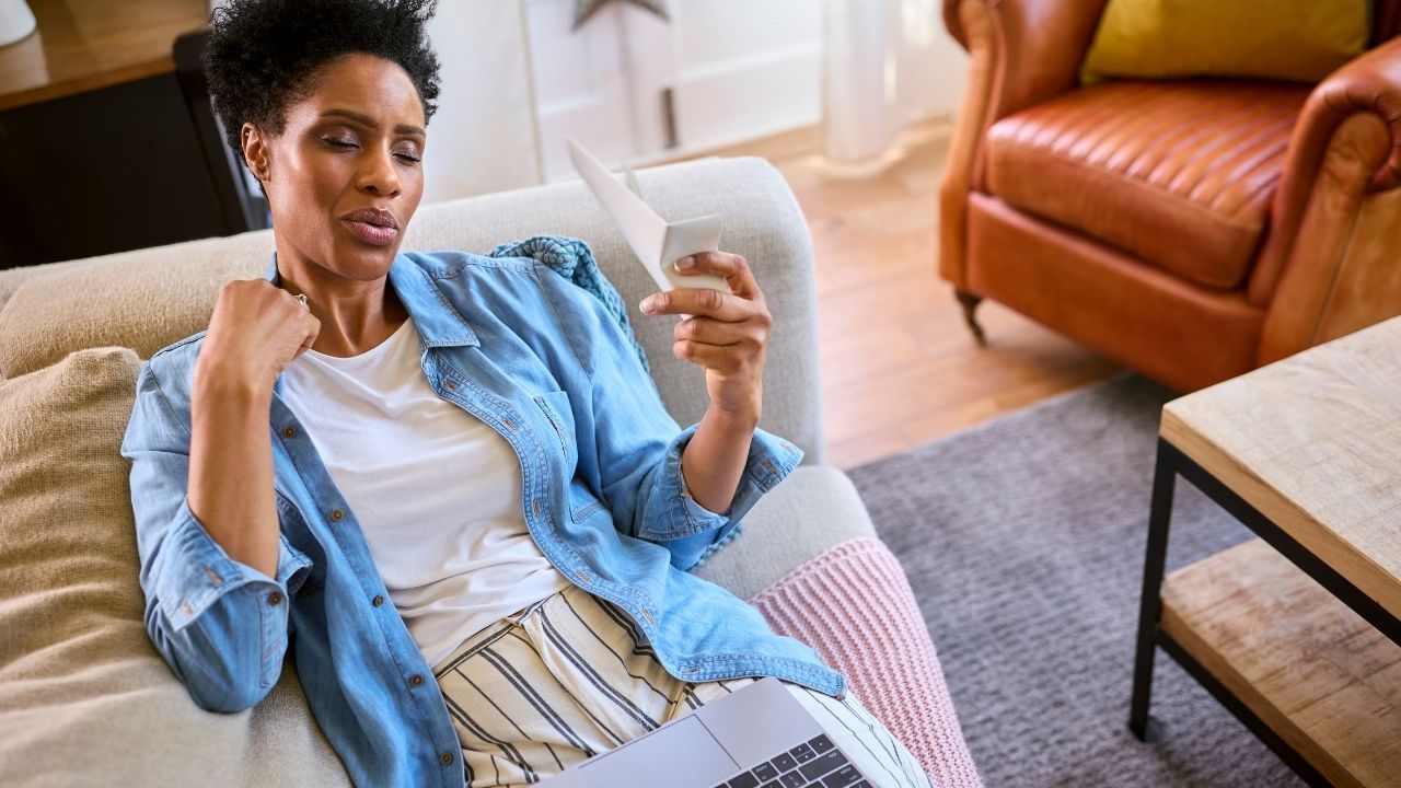 Woman experiencing perimenopause symptoms such as fatigue and brain fog