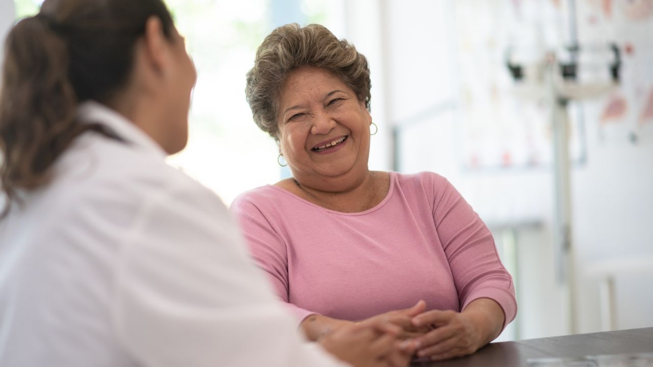midlife woman with doctor discussing heart disease and metabolic health