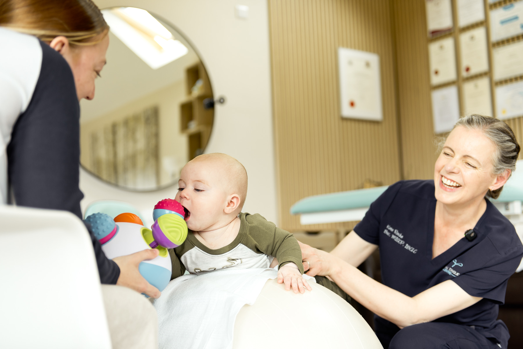 Kate Roche with a family during a clinical consultation