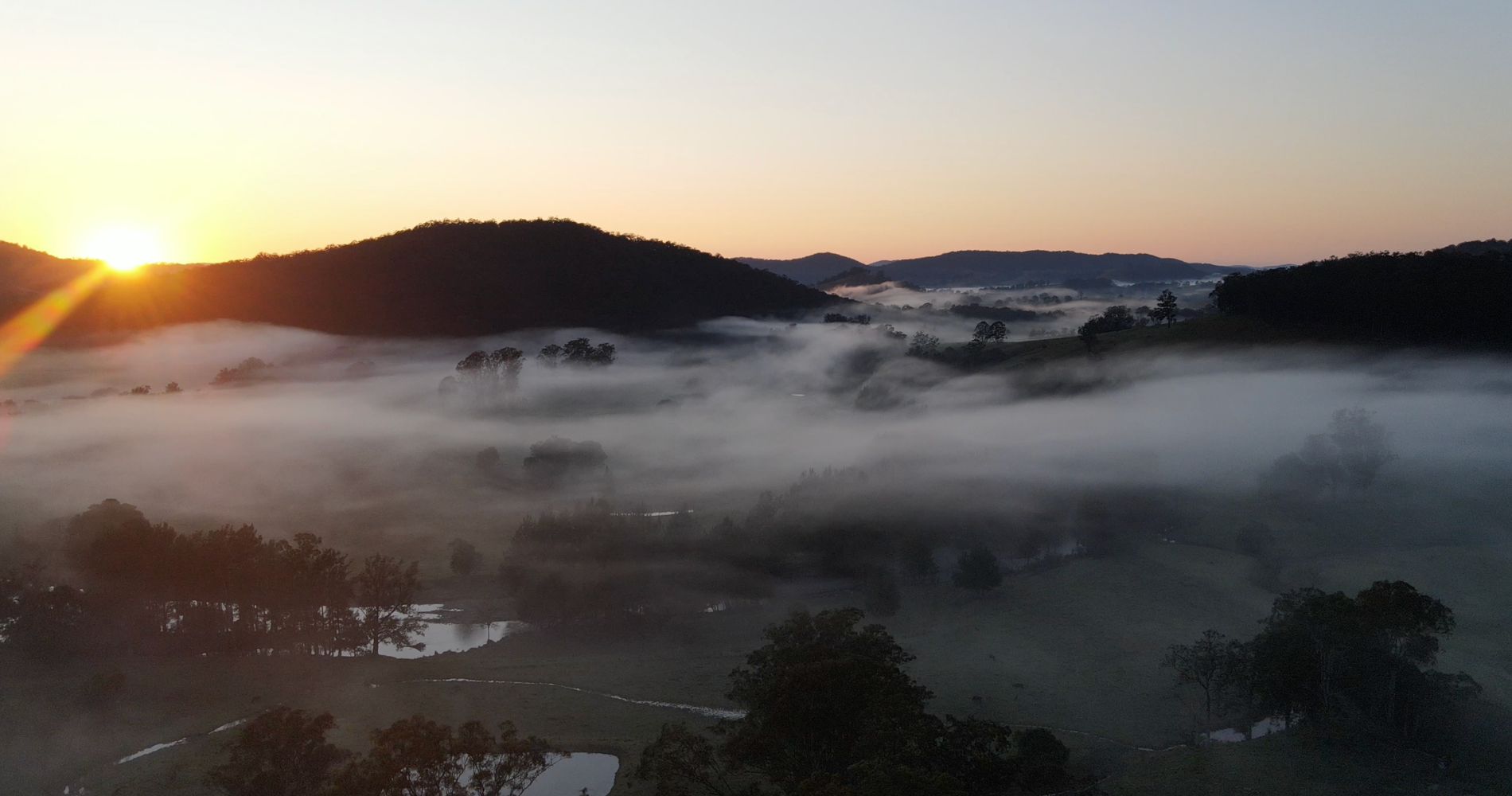 Mist over the hills at sunrise