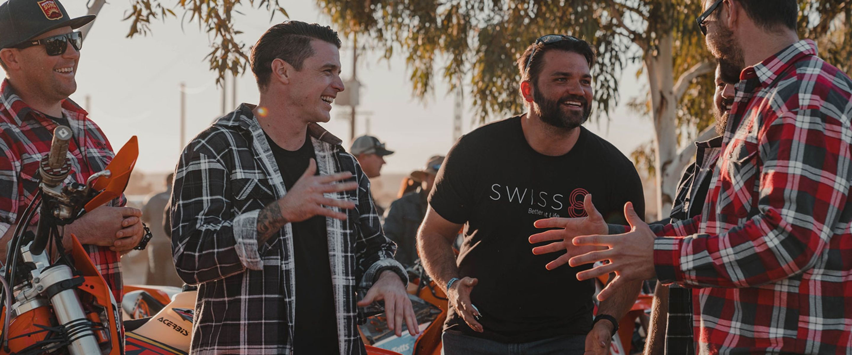 Swiss 8 veterans laughing together outdoors