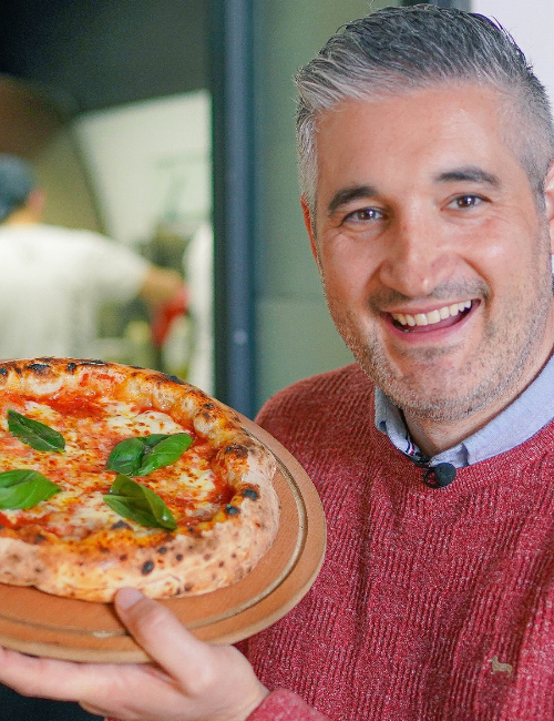 Vincenzo holding a finished Italian dish - final photo placeholder
