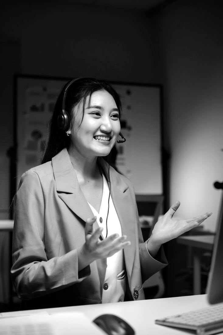A smiling assistant on a headset call