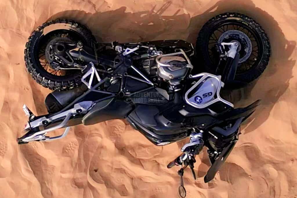 Upside-down BMW R1200GS in the sand