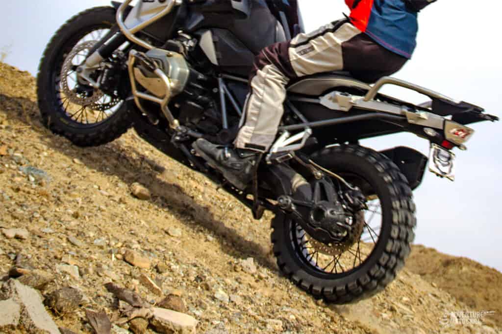 BMW R1200GS motorcycle climbing a steep hill off-road