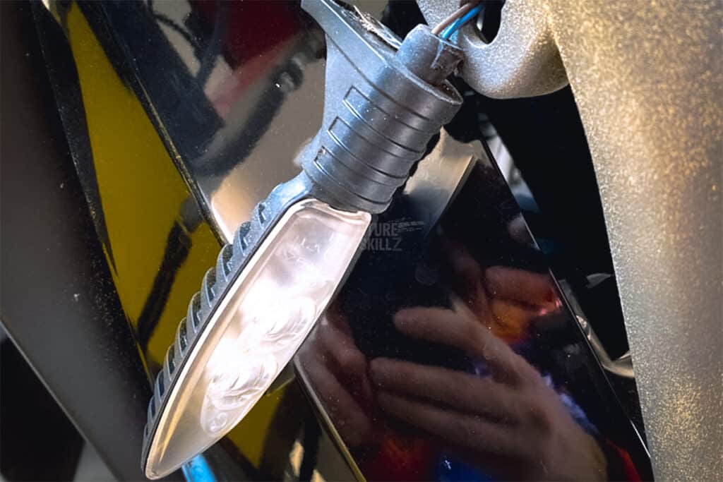 Broken indicator light from a BMW motorcycle