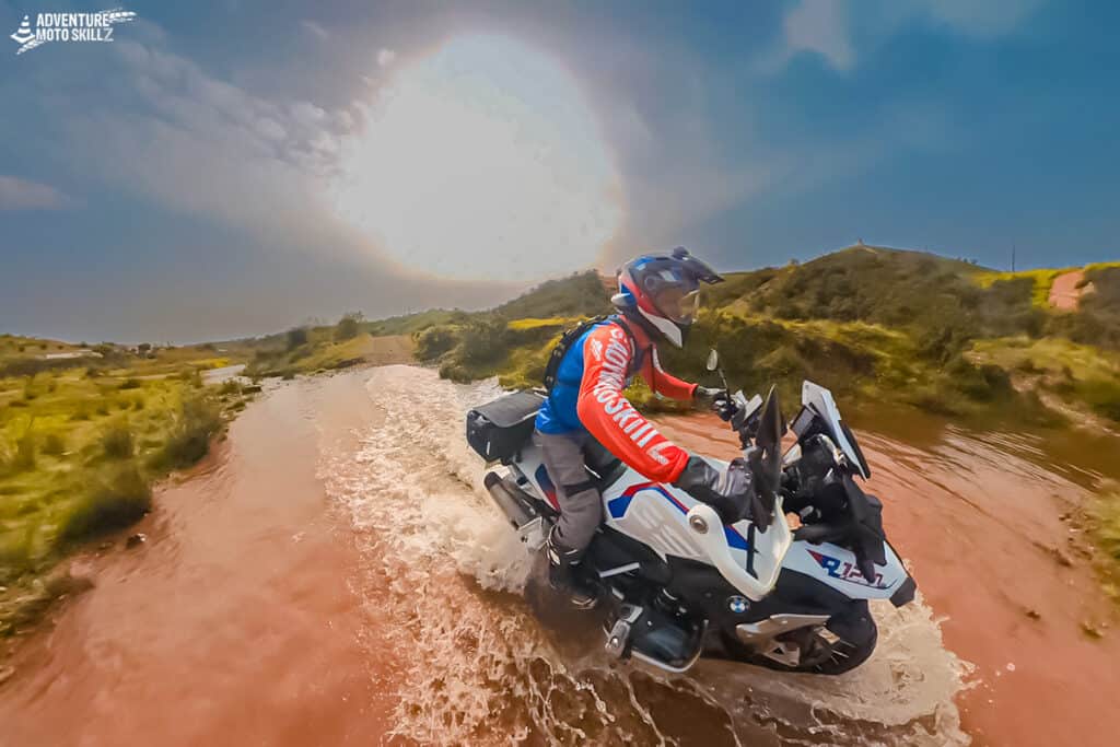 BMW adventure motorcycle crossing deeper water