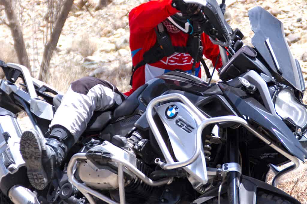 Rider falling off a BMW R1200GS motorcycle