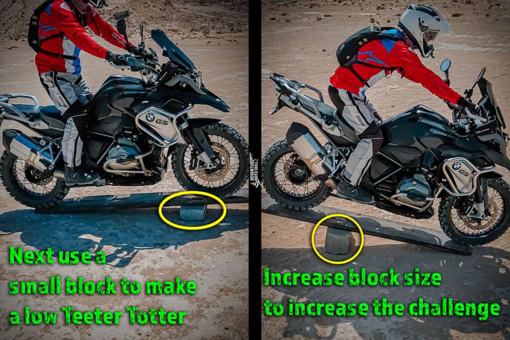 Motorcycle riding over a small teeter-totter obstacle