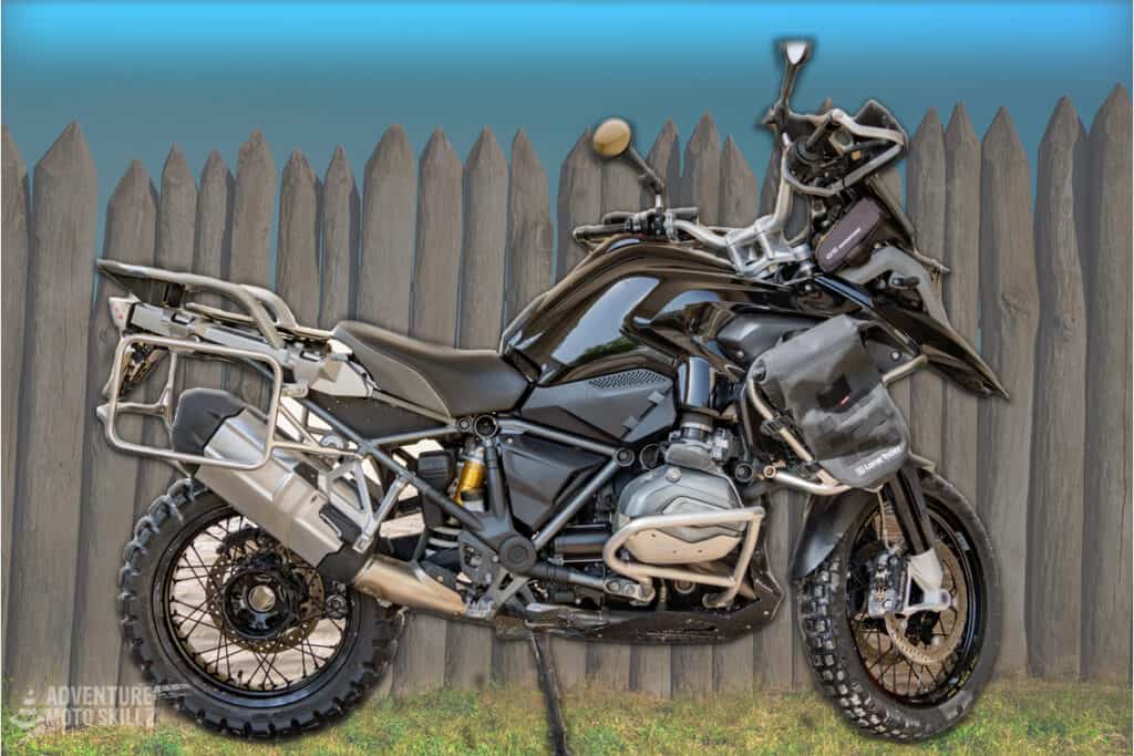 BMW R1200GS parked in front of a fence