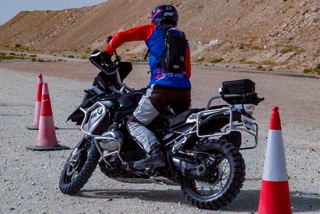 BMW 1200GS motorcycle riding a cone drill