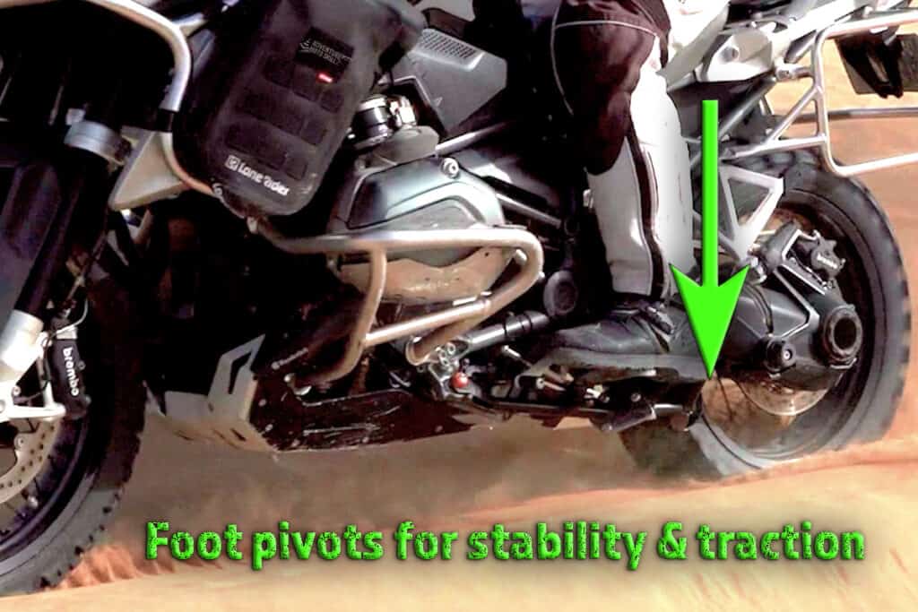 Rider’s boot in mid-arch position on the foot peg with the heel dropped
