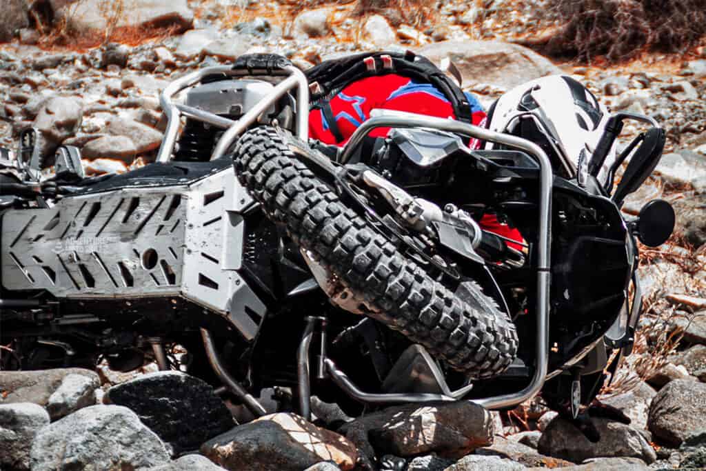 Fallen BMW R1200GS and rider on the trail