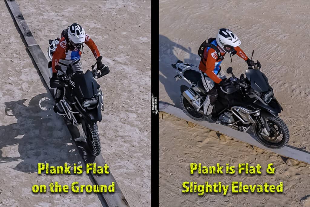 Motorcycle rider riding along a flat wooden plank
