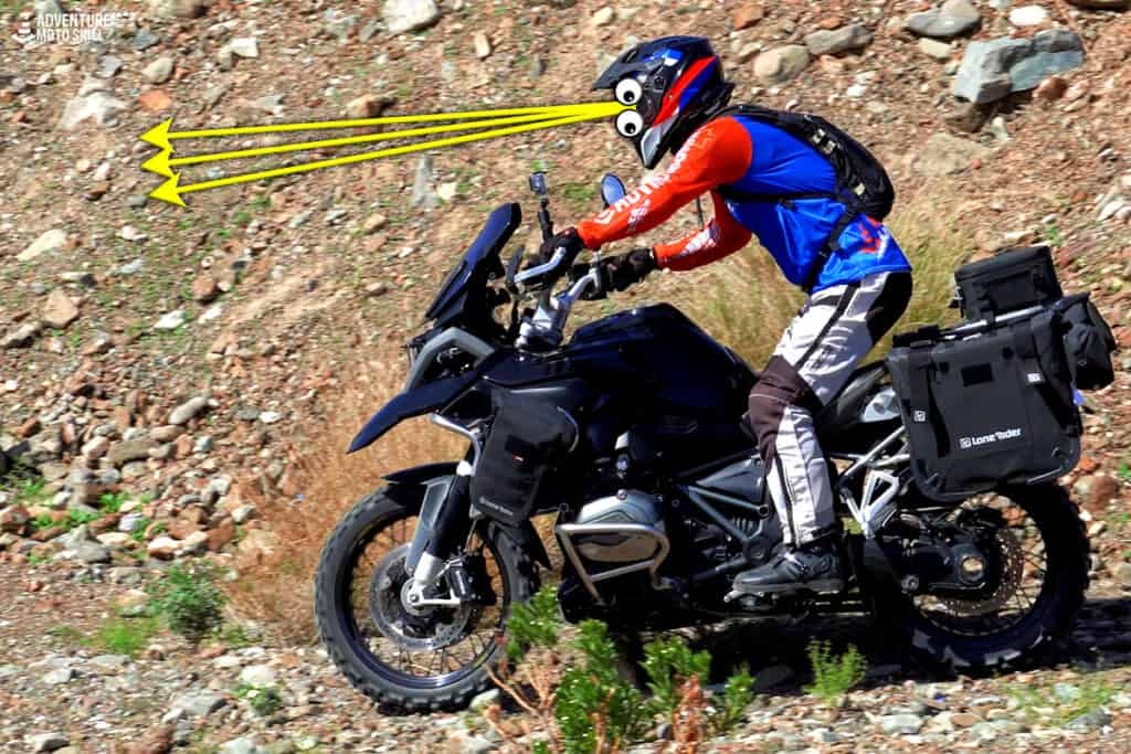 Adventure motorcycle rider in a standing riding position off-road
