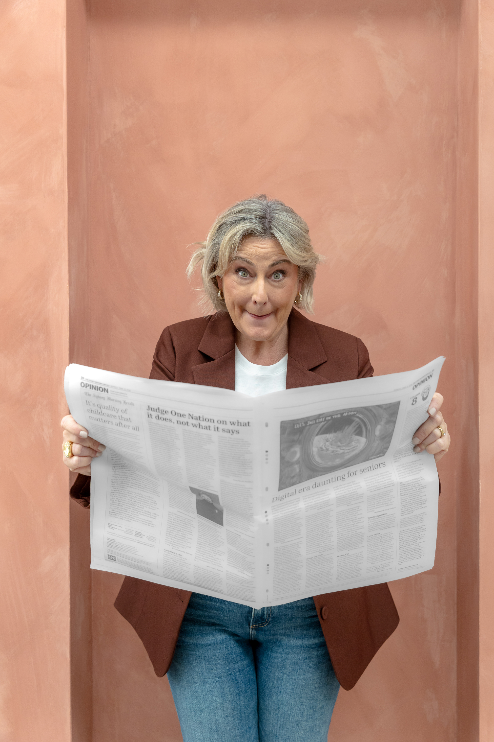 Kylie Sultana reading the Sydney Morning Herald opinion pages