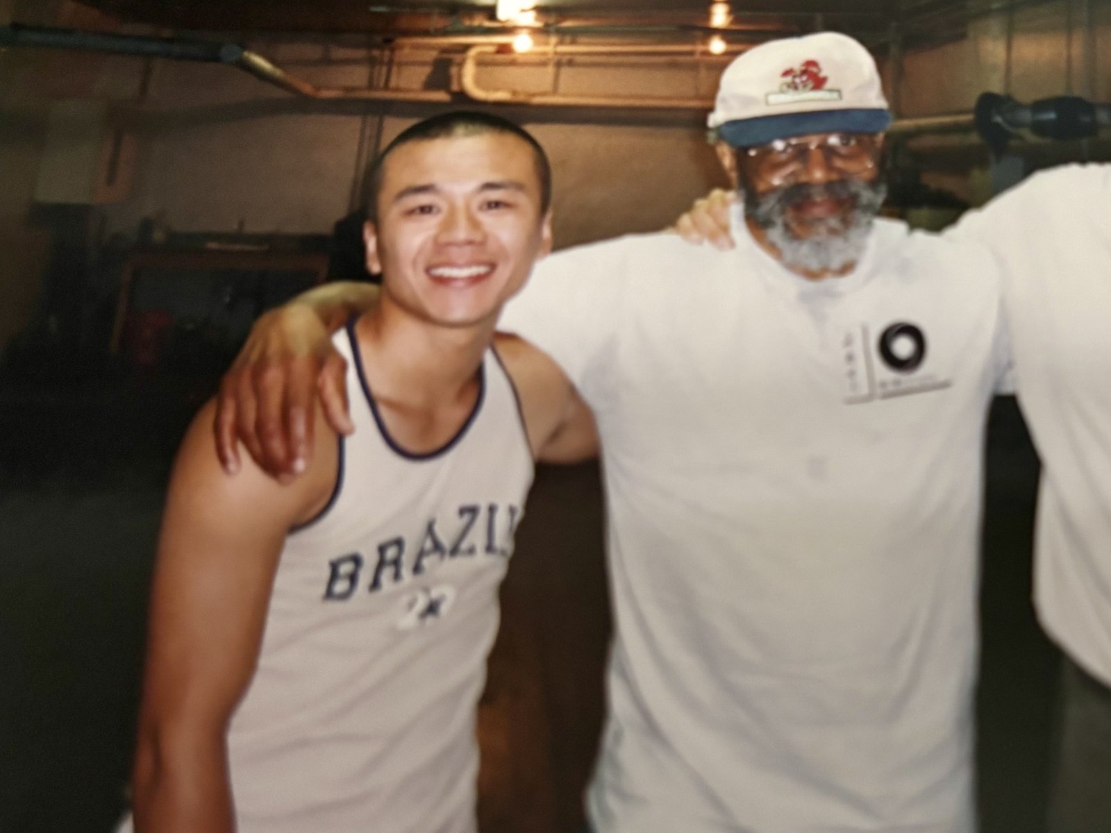 A young Adam Chan with Jesse Glover